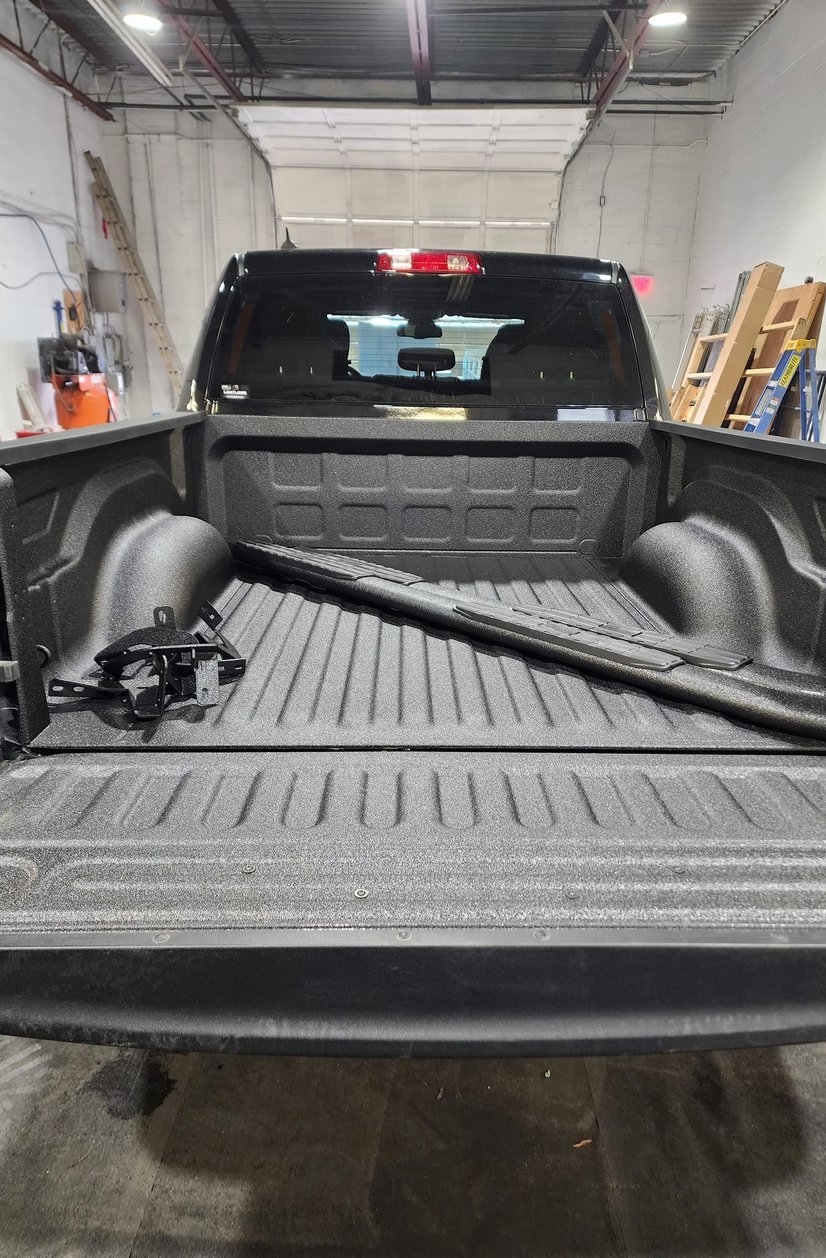 black shiny truck after detailing